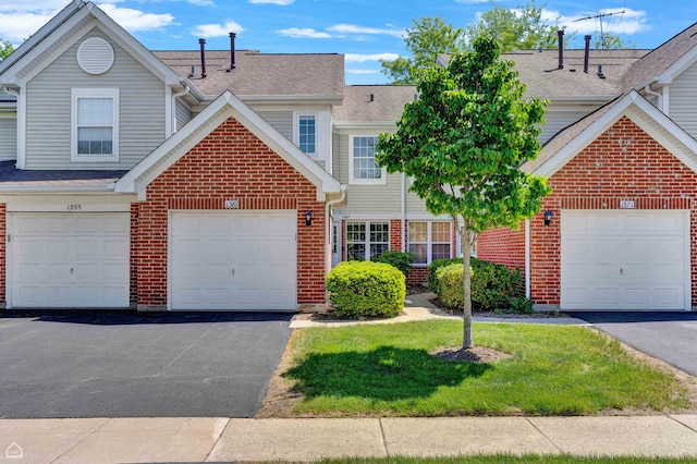 1367 Hampshire Ct, Roselle, IL 60172 - view of front of home featuring brick siding, a front yard, driveway, and a shingled roof