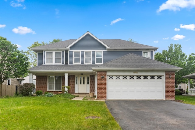 1803 Maroon Bells Ln, Bolingbrook, IL 60490 - traditional home featuring asphalt driveway, brick siding, and a front yard