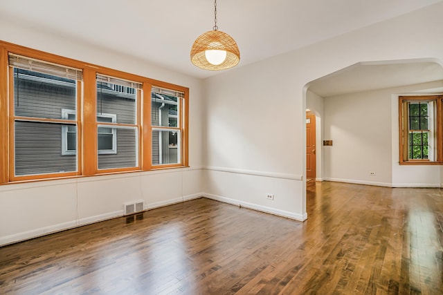 3113 N Osceola Ave, Chicago, IL 60707 - unfurnished room featuring wood finished floors, arched walkways, and baseboards
