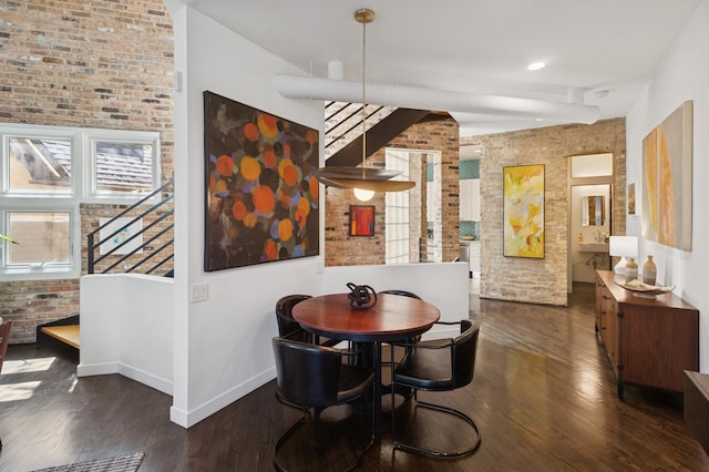 832 W Wolfram St, Chicago, IL 60657 - dining room featuring brick wall, baseboards, dark wood-style floors, and stairs