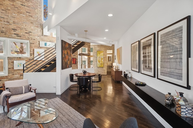 832 W Wolfram St, Chicago, IL 60657 - living area featuring wood finished floors, stairway, brick wall, baseboards, and recessed lighting