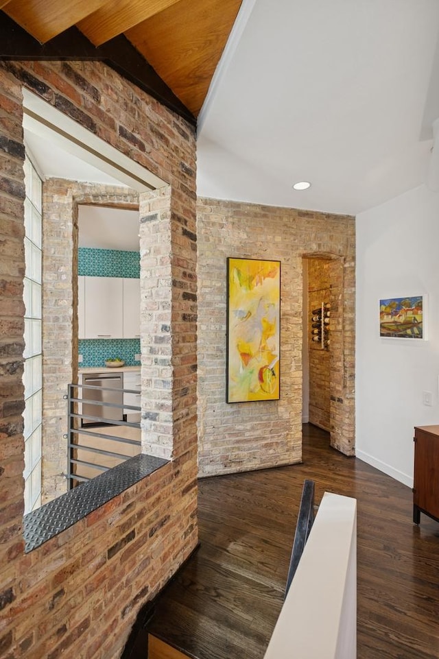 832 W Wolfram St, Chicago, IL 60657 - hallway with wood finished floors, baseboards, brick wall, and recessed lighting