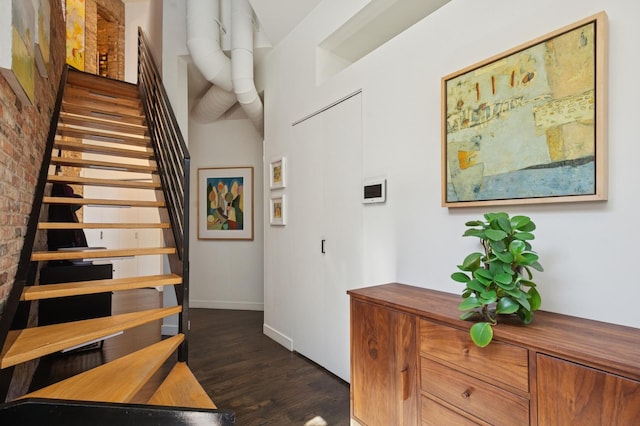 832 W Wolfram St, Chicago, IL 60657 - stairs featuring wood finished floors, baseboards, and brick wall