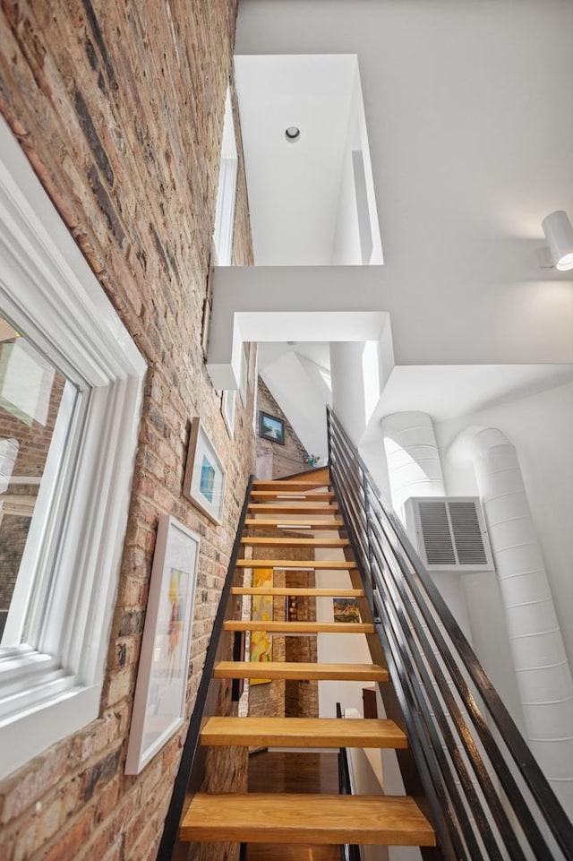 832 W Wolfram St, Chicago, IL 60657 - staircase featuring brick wall and a high ceiling