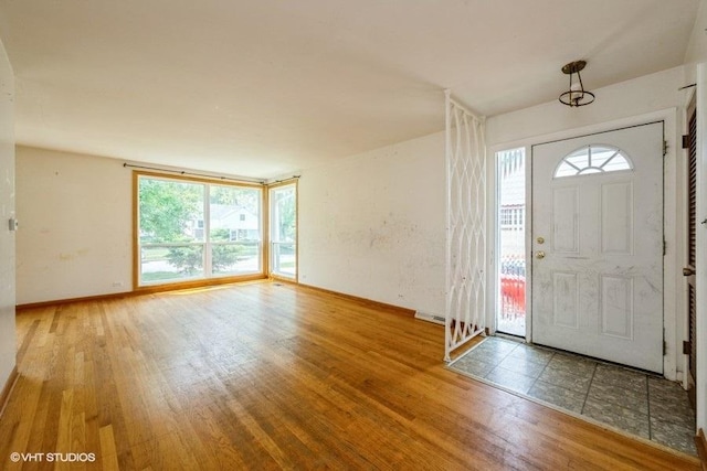9011 Menard Ave, Morton Grove, IL 60053 - foyer entrance with wood finished floors and baseboards