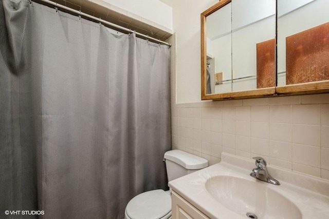 9011 Menard Ave, Morton Grove, IL 60053 - bathroom with tile walls, toilet, vanity, curtained shower, and tasteful backsplash