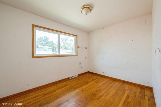 9011 Menard Ave, Morton Grove, IL 60053 - unfurnished room with light wood-style flooring and baseboards