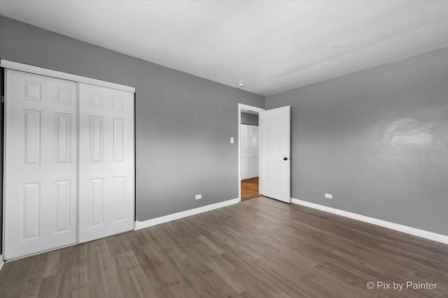 2756 Lancaster Dr, Markham, IL 60428 - unfurnished bedroom featuring wood finished floors, baseboards, and a closet