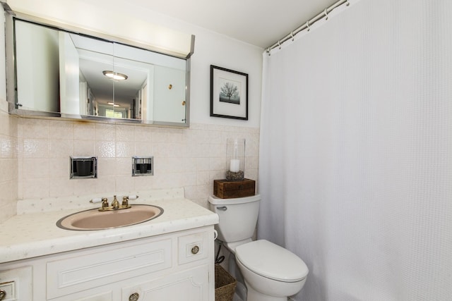 5540 Walnut Ave Unit 23C, Downers Grove, IL 60515 - bathroom with toilet, vanity, tile walls, and a shower with curtain