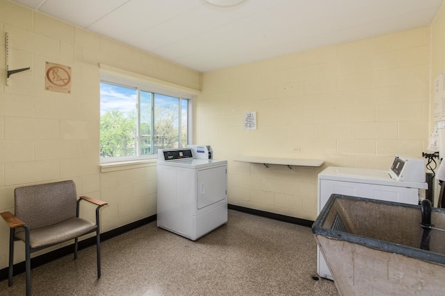 5540 Walnut Ave Unit 23C, Downers Grove, IL 60515 - shared laundry room featuring washing machine and dryer and concrete block wall