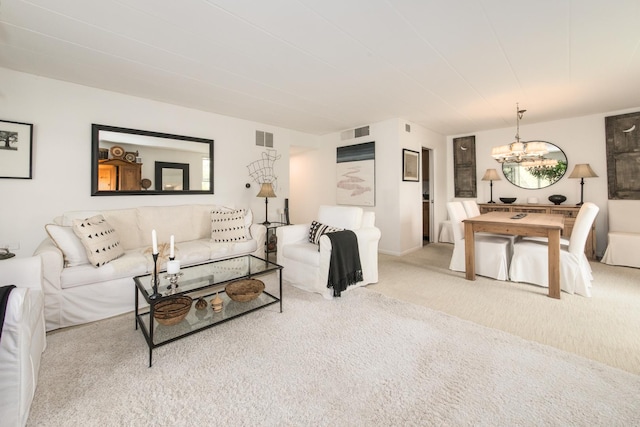 5540 Walnut Ave Unit 23C, Downers Grove, IL 60515 - carpeted living room featuring a chandelier