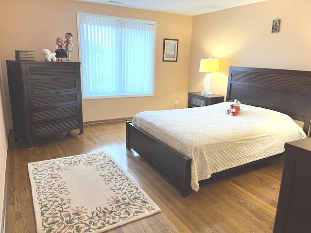 8001 W Courte Dr Unit 307, Niles, IL 60714 - bedroom with wood finished floors and baseboards