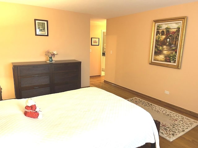 8001 W Courte Dr Unit 307, Niles, IL 60714 - bedroom featuring wood finished floors and baseboards