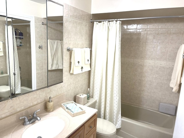 8001 W Courte Dr Unit 307, Niles, IL 60714 - bathroom with tile walls, toilet, shower / tub combo, backsplash, and vanity