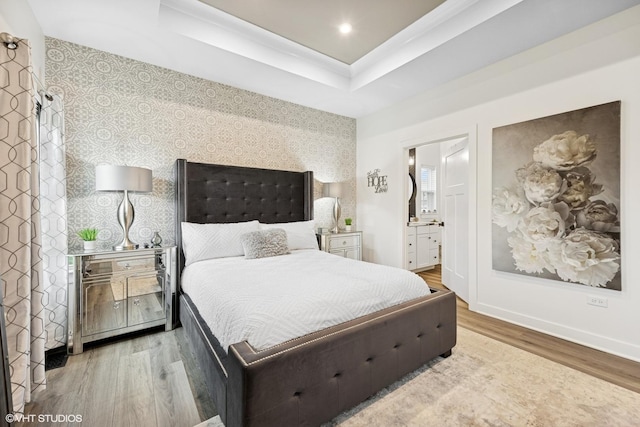 319 Carole St, Sugar Grove, IL 60554 - bedroom featuring wallpapered walls, wood finished floors, a tray ceiling, baseboards, and connected bathroom