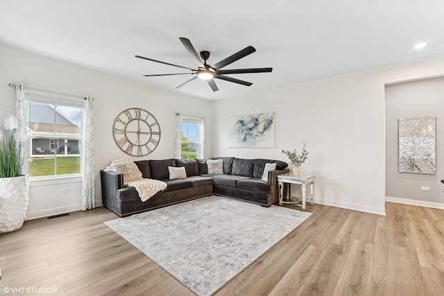 319 Carole St, Sugar Grove, IL 60554 - living area featuring ceiling fan, light wood-style floors, and baseboards