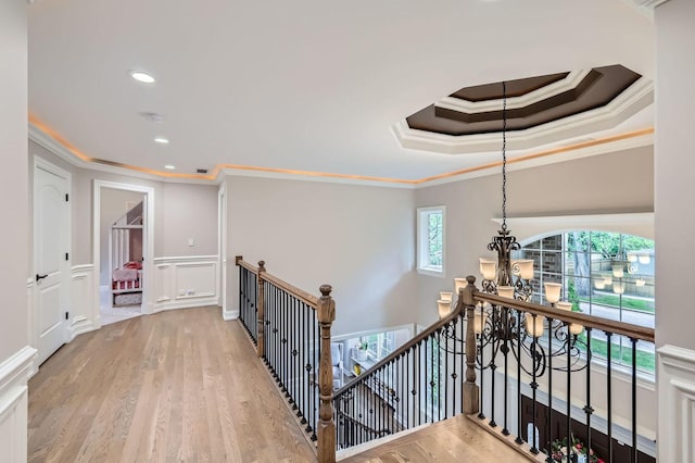 349 Home Ave, Itasca, IL 60143 - hallway with an upstairs landing, a chandelier, crown molding, wood finished floors, and a decorative wall