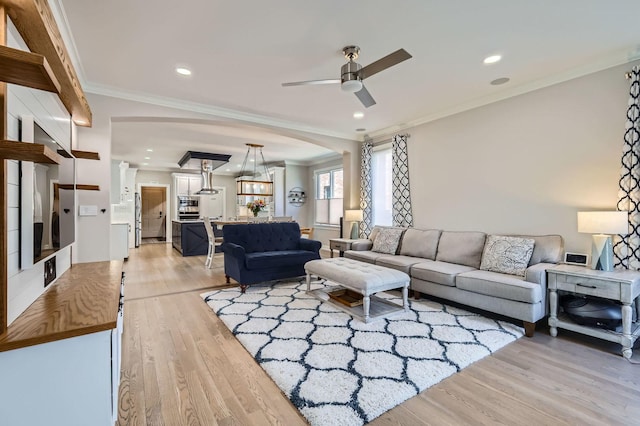 349 Home Ave, Itasca, IL 60143 - living room featuring ornamental molding, light wood-style flooring, ceiling fan, arched walkways, and recessed lighting