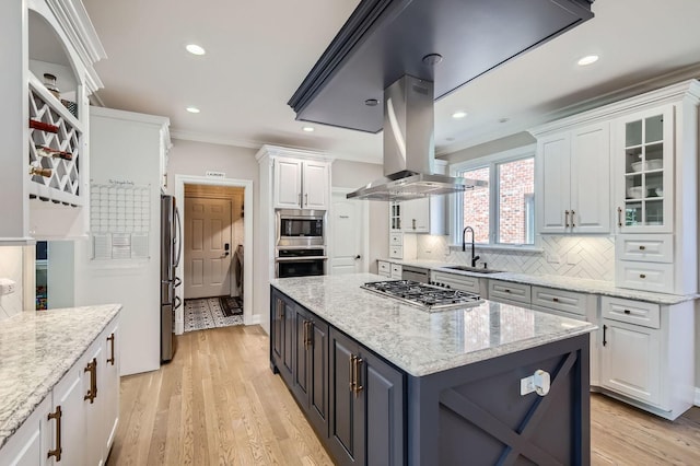 349 Home Ave, Itasca, IL 60143 - kitchen with stainless steel appliances, island exhaust hood, a sink, white cabinets, and tasteful backsplash