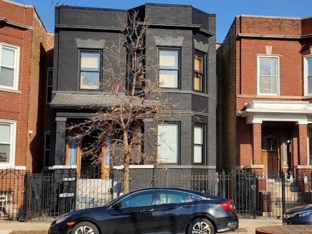 view of front of home featuring brick siding