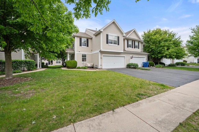 1481 Cambria Dr Unit 1, Dekalb, IL 60115 - townhome / multi-family property featuring an attached garage, a front yard, and asphalt driveway