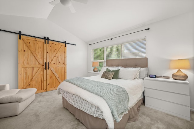 1481 Cambria Dr Unit 1, Dekalb, IL 60115 - bedroom featuring a barn door, light colored carpet, lofted ceiling, and ceiling fan