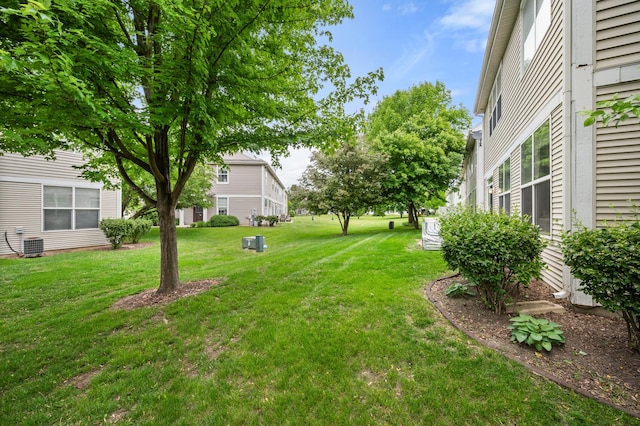 1481 Cambria Dr Unit 1, Dekalb, IL 60115 - view of green lawn featuring central AC