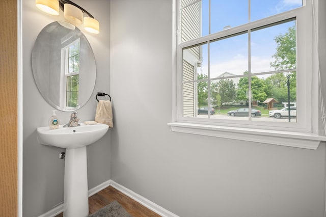1481 Cambria Dr Unit 1, Dekalb, IL 60115 - bathroom featuring wood finished floors and baseboards