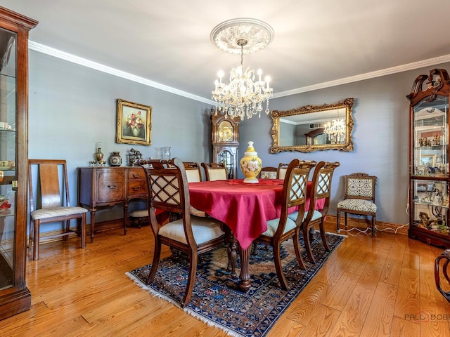 1010 Hampshire Ln, Elgin, IL 60120 - dining room with a chandelier, hardwood / wood-style flooring, and ornamental molding