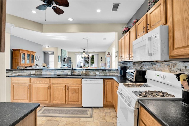 13569 Winterberry Ln, Huntley, IL 60142 - kitchen featuring a ceiling fan, white appliances, a sink, tasteful backsplash, and light stone finish floors