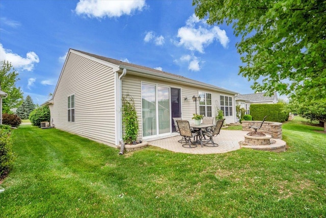 13569 Winterberry Ln, Huntley, IL 60142 - rear view of property featuring a patio, a fire pit, and a yard
