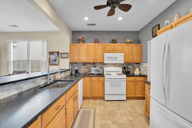 13569 Winterberry Ln, Huntley, IL 60142 - kitchen with white appliances, a sink, backsplash, dark countertops, and ceiling fan