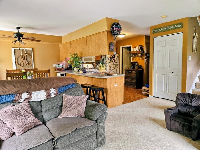 25159 Faraday Rd, Manhattan, IL 60442 - carpeted living room featuring ceiling fan and stairway