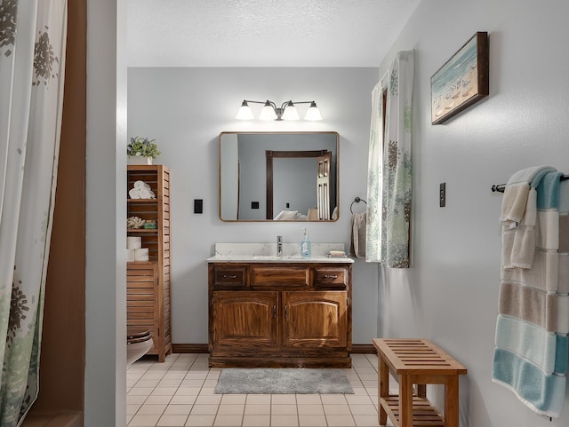 279 N Division St, Braidwood, IL 60408 - bathroom with tile patterned flooring, vanity, and baseboards