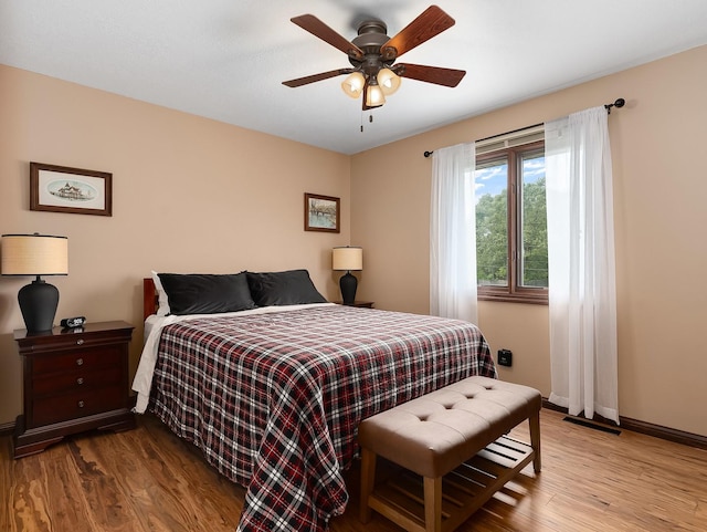 279 N Division St, Braidwood, IL 60408 - bedroom with wood finished floors, baseboards, and a ceiling fan