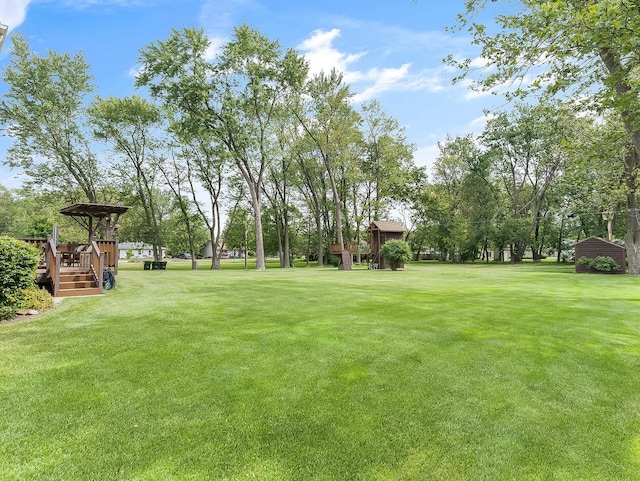 279 N Division St, Braidwood, IL 60408 - view of green lawn with a deck
