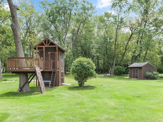 279 N Division St, Braidwood, IL 60408 - view of green lawn with a deck and view of scattered trees