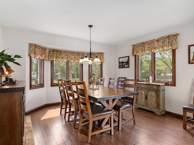 279 N Division St, Braidwood, IL 60408 - dining space with healthy amount of natural light, hardwood / wood-style flooring, baseboards, and a chandelier