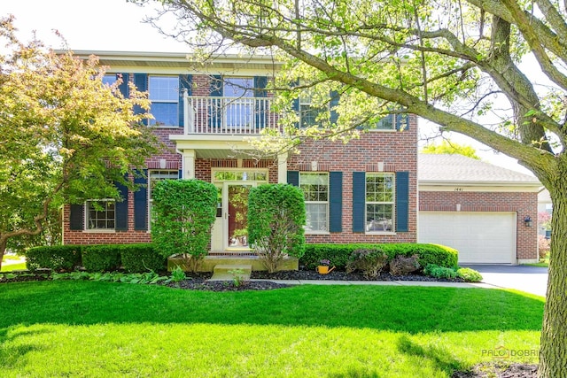 1441 Sutton Pl, Gurnee, IL 60031 - colonial inspired home featuring brick siding, a balcony, an attached garage, and a front lawn