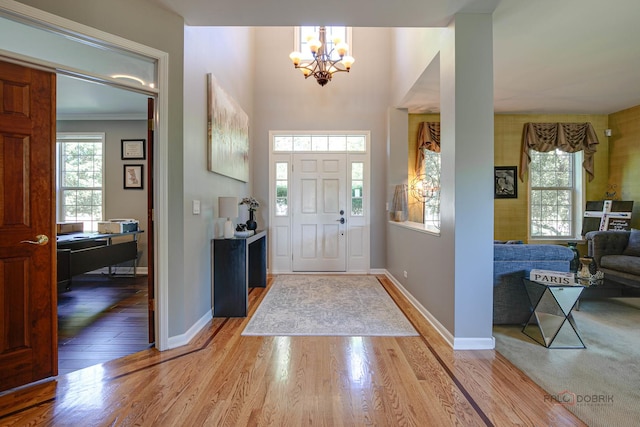1441 Sutton Pl, Gurnee, IL 60031 - foyer with a chandelier, wood finished floors, and baseboards