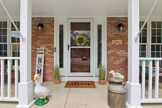 1034 Willoby Ln, Elgin, IL 60120 - doorway to property featuring brick siding and a porch