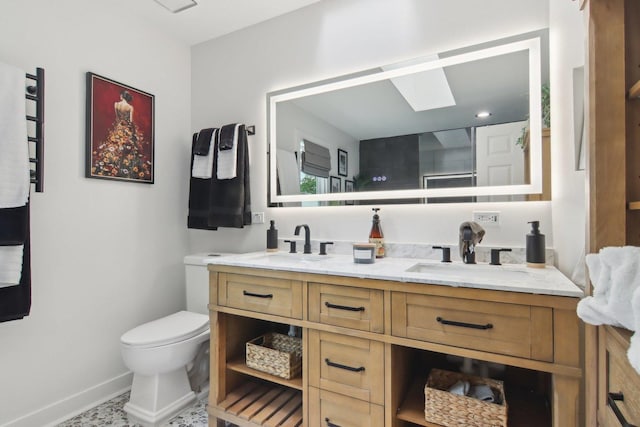 1034 Willoby Ln, Elgin, IL 60120 - full bath with double vanity, toilet, baseboards, and a towel warming rack