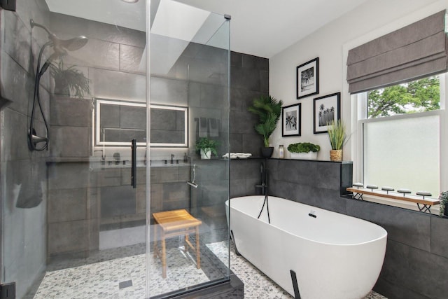 1034 Willoby Ln, Elgin, IL 60120 - bathroom featuring a shower stall, tile walls, and a soaking tub