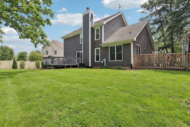 1034 Willoby Ln, Elgin, IL 60120 - rear view of property with a chimney, a wooden deck, a shingled roof, and central AC unit