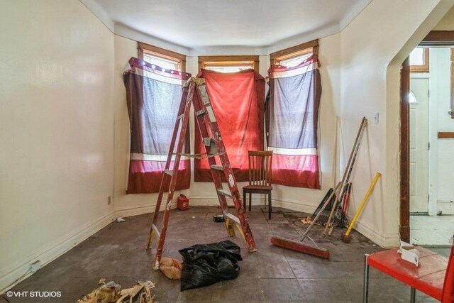 6151 S Marshfield Ave, Chicago, IL 60636 - unfurnished dining area featuring baseboards and arched walkways