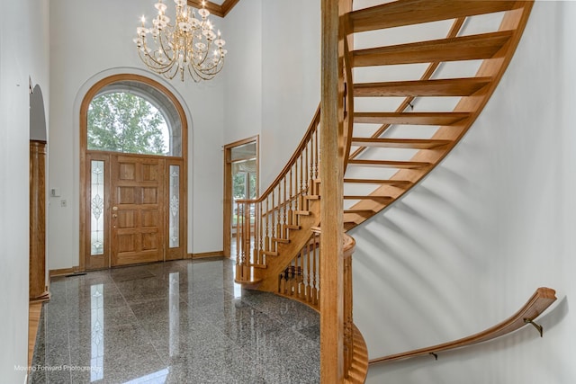1773 W Whispering Ct, Addison, IL 60101 - foyer featuring a towering ceiling, granite floors, stairs, and a chandelier