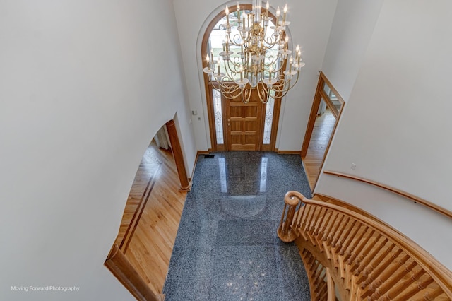 1773 W Whispering Ct, Addison, IL 60101 - foyer entrance with a towering ceiling, granite tiled floors, and a chandelier