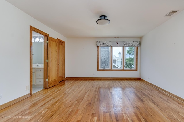 1773 W Whispering Ct, Addison, IL 60101 - empty room with light wood finished floors and baseboards