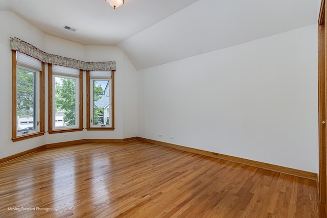 1773 W Whispering Ct, Addison, IL 60101 - spare room with lofted ceiling and light wood-type flooring