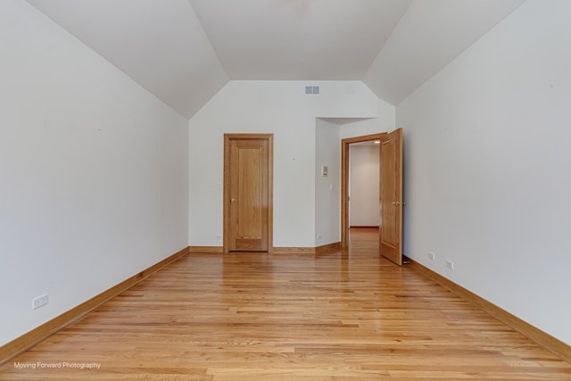 1773 W Whispering Ct, Addison, IL 60101 - spare room featuring light wood-type flooring and lofted ceiling